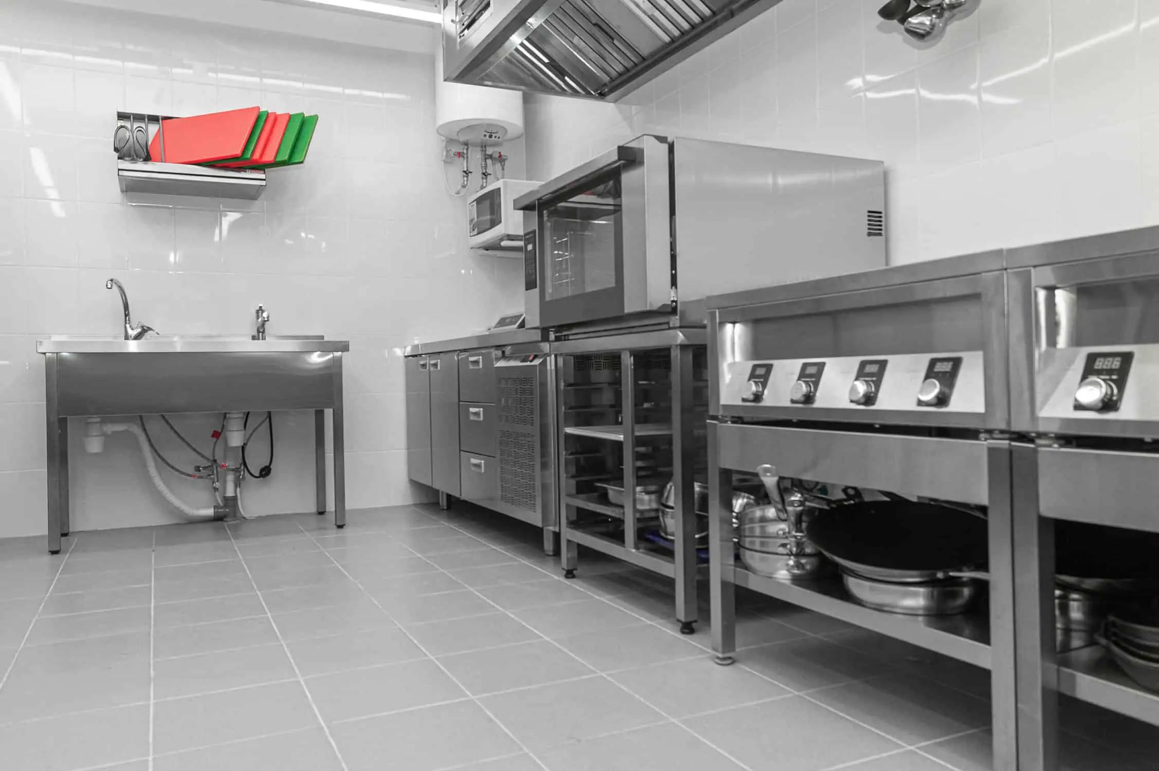 Design of the working area of the commercial cafe kitchen with s Design of the working area of the commercial cafe kitchen with stainless steel equipments, hot shop, food industry.