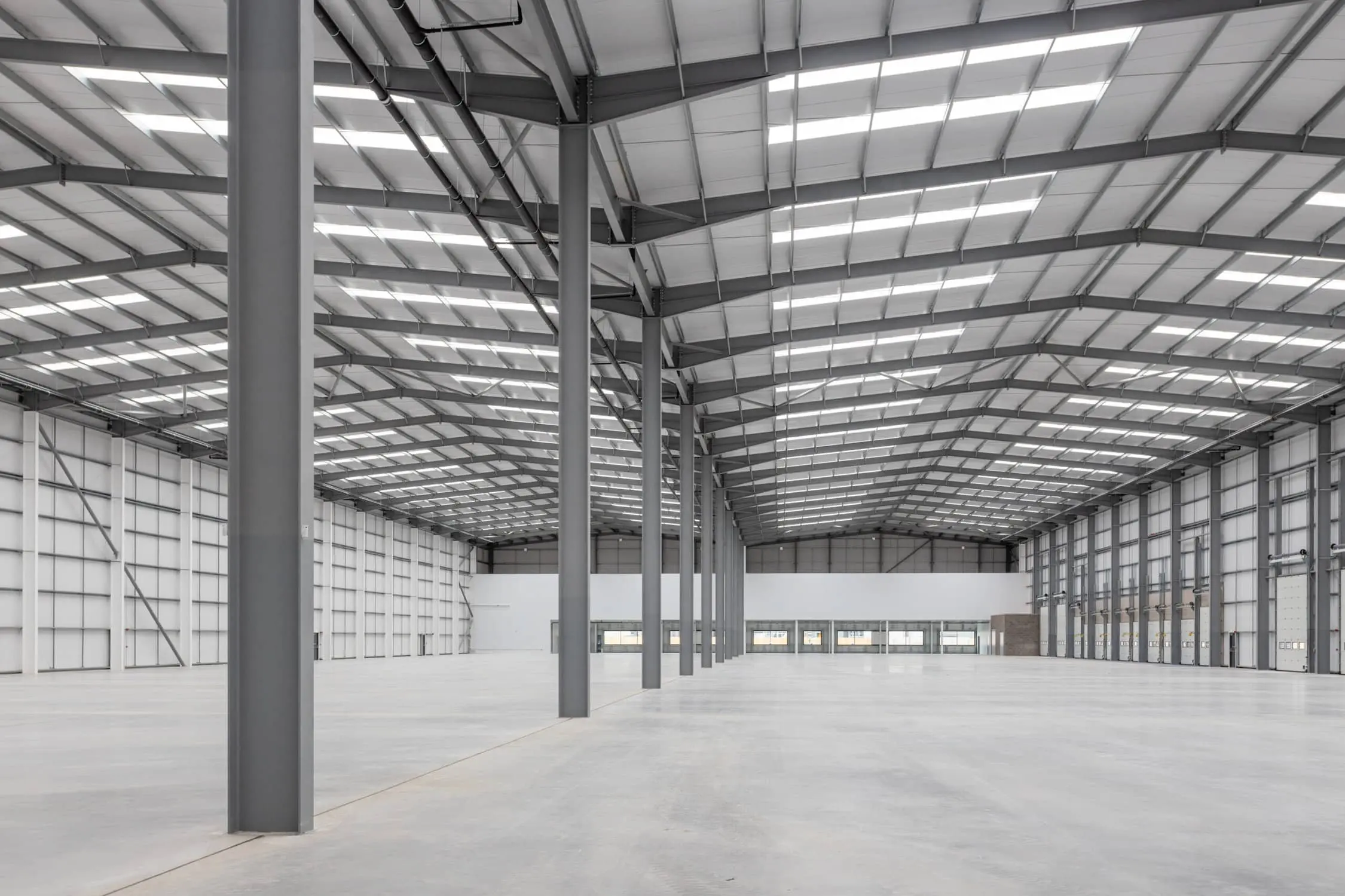 An interior of a large warehouse An interior of a large warehouse