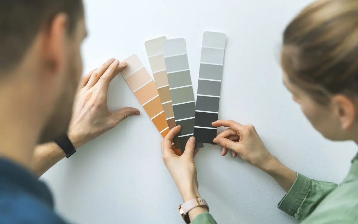 couple choosing paint color and lighting
